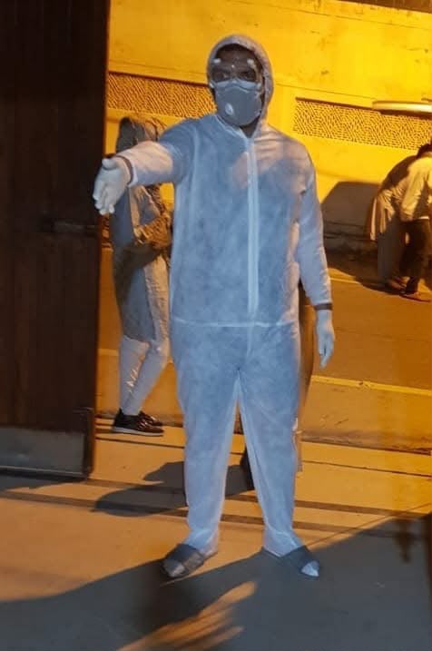 Health Warriors volunteer in protective clothing during an oxygen-support operation